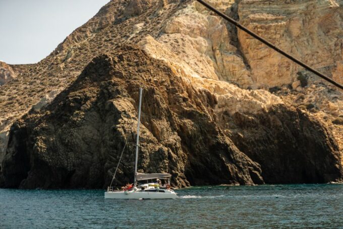 Santorini: Sailing Catamaran Yacht Cruise With Food & Drinks - Unlimited Drinks on Board