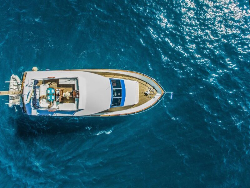 Santorini: Semi Private Boat Tour With Food and Wine - Santorinis Fabled Sunsets