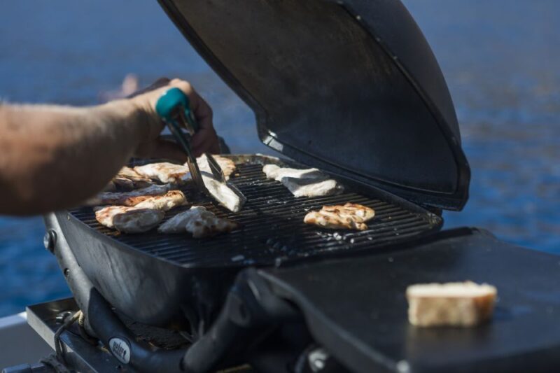 Santorini: Traditional Wooden Boat Tour With Meal and Wine - Scenic Views and Photo Opportunities