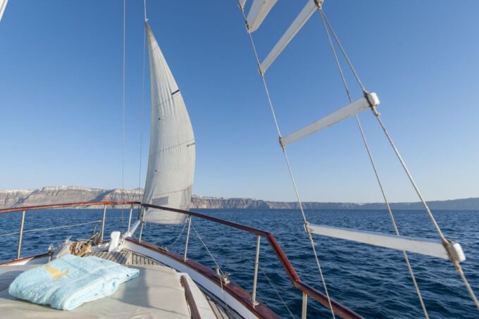 Santorini: Traditional Wooden Boat Tour With Meal and Wine - Sunset Option and Thirassia Island