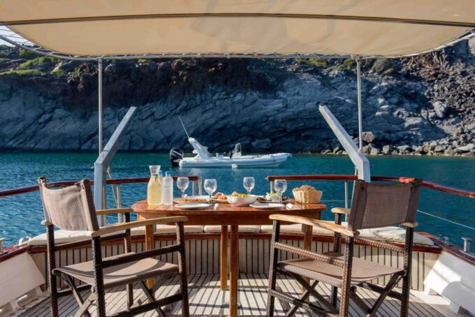 Santorini: Traditional Wooden Boat Tour With Meal and Wine - Frequently Asked Questions