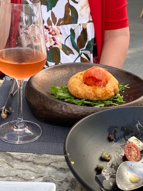 Santorini: Wine Tasting in 3 Wineries and a Greek Meal Group - Itinerary and Wine Experiences