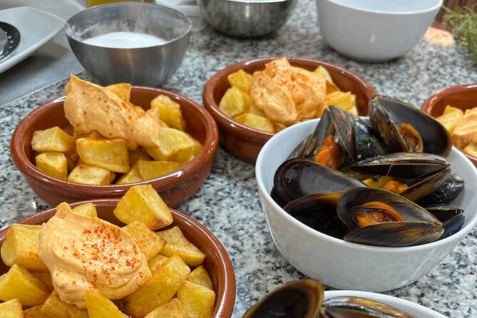 Seafood Paella Cooking Class, Tapas and Visit to Ruzafa Market. - Location and Meeting Details