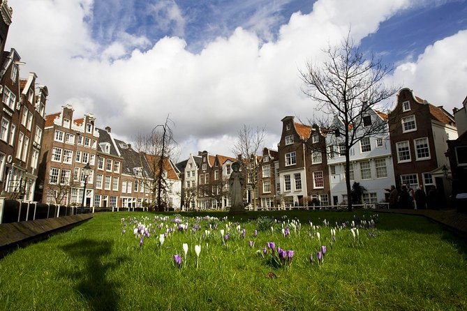 Secrets of Amsterdam Walking Tour Plus Dutch Sweets Tasting - Exploring Amsterdams History