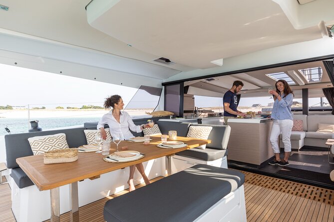Semi-Private Brand-New Catamaran Cruise in Mykonos With Meal, Drinks & Transport - Visiting the Mykonian Coast