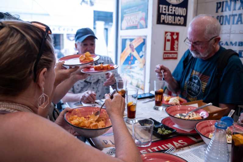 Seville Adventure: Historic Walking Tour & Traditional Tapas - Exploring Historical Sights