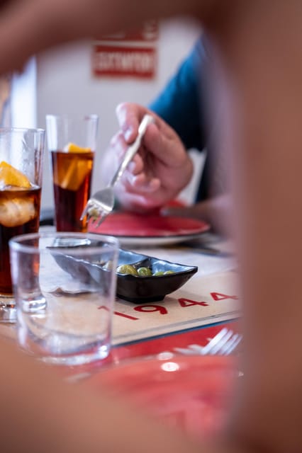 Seville Adventure: Historic Walking Tour & Traditional Tapas - Savoring Local Cuisine