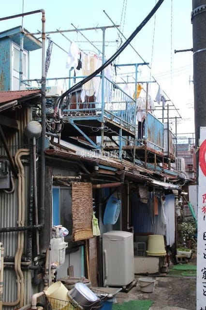 Shinjuku Kawasaki Tokyo Slum Red Light Walking Tour W/Pickup - Exploring Kawasaki Slums