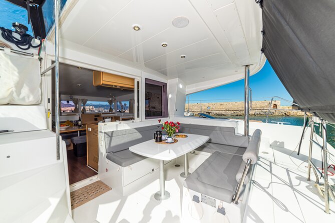 Small Group Santorini Catamaran Cruise With BBQ - Swimming in the Clear Blue Sea