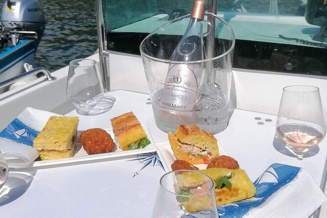 Sunset Boat Cruise With Wine and Fish Tasting From Garda - Booking and Reservation Details