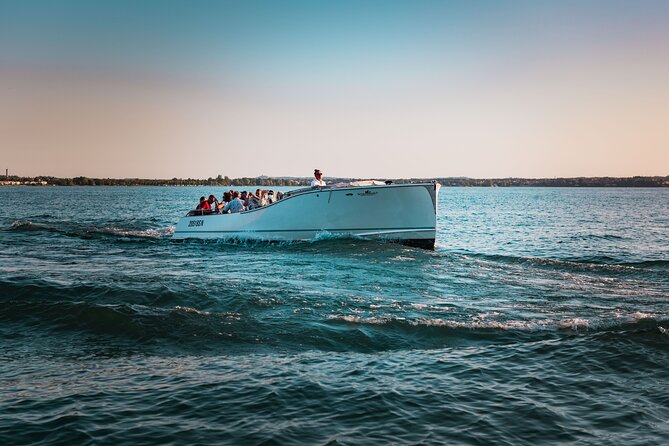 Sunset Boat Tour of Sirmione With Exclusive Onboard Aperitif - Confirmation and Accessibility Information