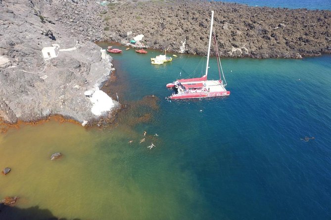Sunset Sailing Catamaran Cruise in Santorini With BBQ and Drinks - Snorkeling and Exploring the Coastal Wonders