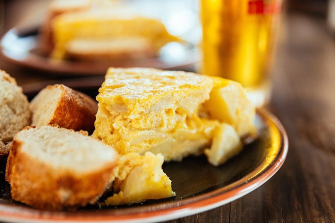 The Beauty of Madrid by Bike: Private Tour - Local Cuisine Experience