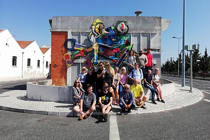 The Real Lisbon Street Art Small-Group Guided Tour by Minivan - Unique Insights and Community Impact