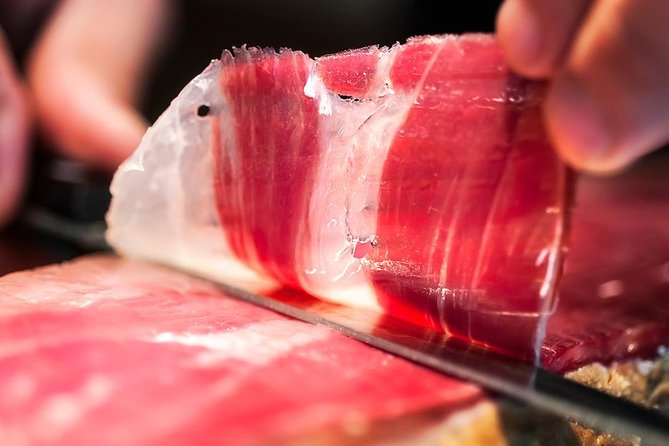 Tour Paella and Malaga Market With an Official Guide - Highlights and Inclusions