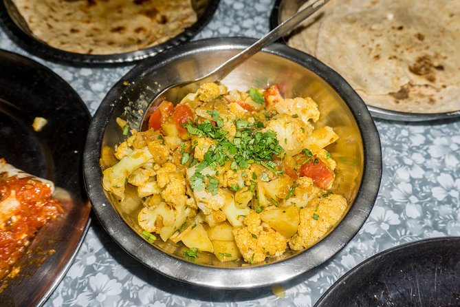 Traditional Indian Home Cooking Class and Market Tour in New Delhi - Cancellation and Pricing Information