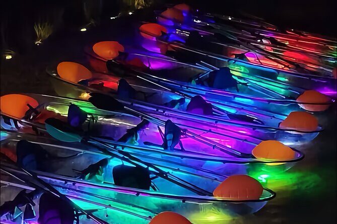 Transparent Canoes Illuminated on the Seawall of Hope - Key Points