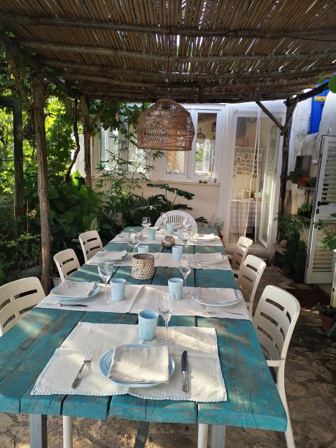 Typical Apulian Dinner in the Garden of an Ancient Trullo - Host and Language Support