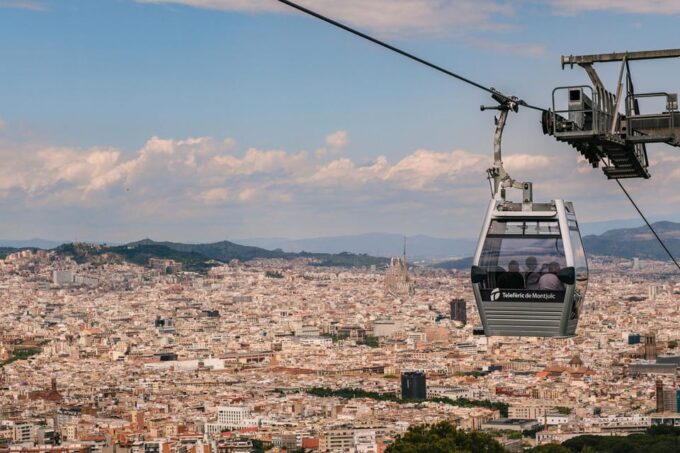 Unforgettable Barcelona: Ebike Tour, Catamaran & Cable Car - Cable Car Ascent to Montjuïc